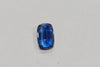 Blue gemstone on a light gray background