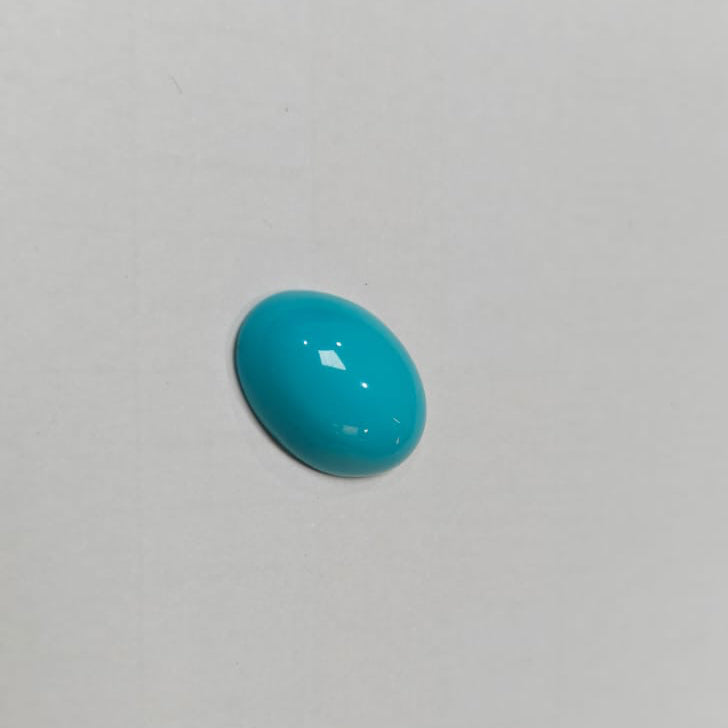 Turquoise stone on a light gray background
